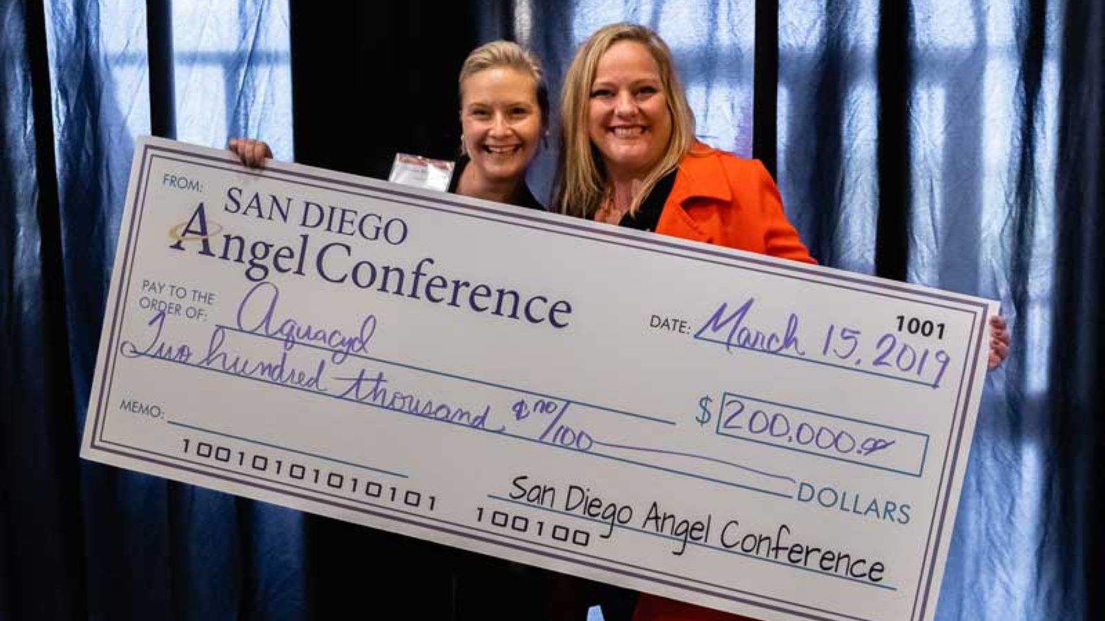 Recipient of check from the San Diego Angel Conference at The Brink SBDC