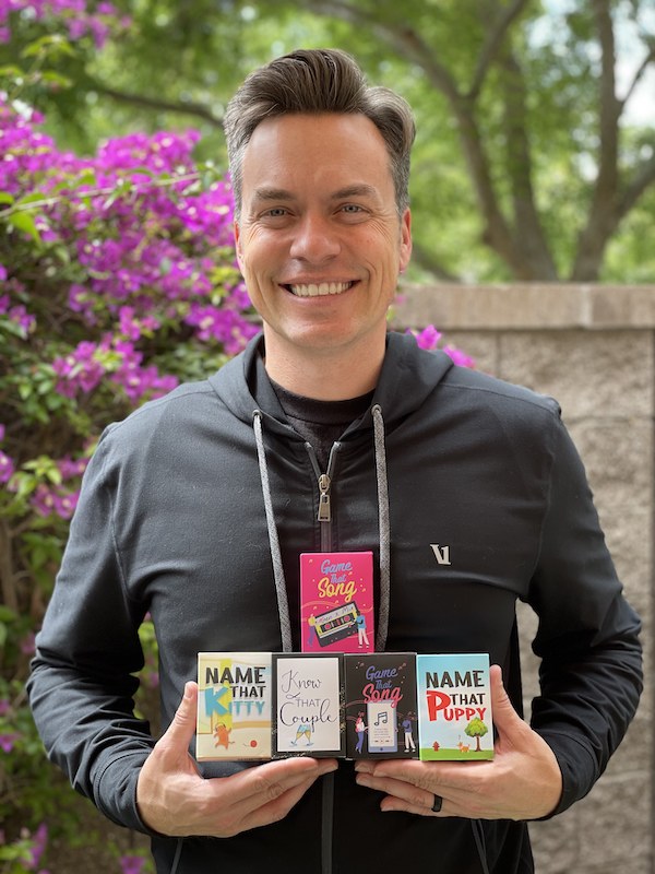 Shopping small can mean getting creative, from unique gifts to gift cards. Pictured is entrepreneur Eric Robertson who created a series of games starting with Game That Song, using San Diego and Imperial SBDC services.