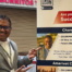 ChargeNet CEO Tosh Dutt poses with his success story photo for the San Diego & Imperial Small Business Development Center (SBDC) Network hosted by Southwestern College.